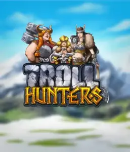 Графика слота "Troll Hunters" от Play'N Go, на котором представлены три воина-викинга: две женщины и один мужчина, облаченные в традиционные викингские доспехи. На фоне виднеются горные вершины, что создаёт атмосферу северных легенд. Этот игровой автомат идеален для поклонников скандинавской культуры и поисков приключений.